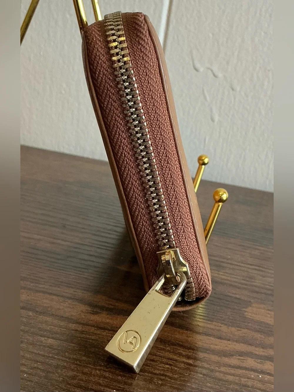 A rare vintage Adrienne Vittadini cognac color zip around leather wallet